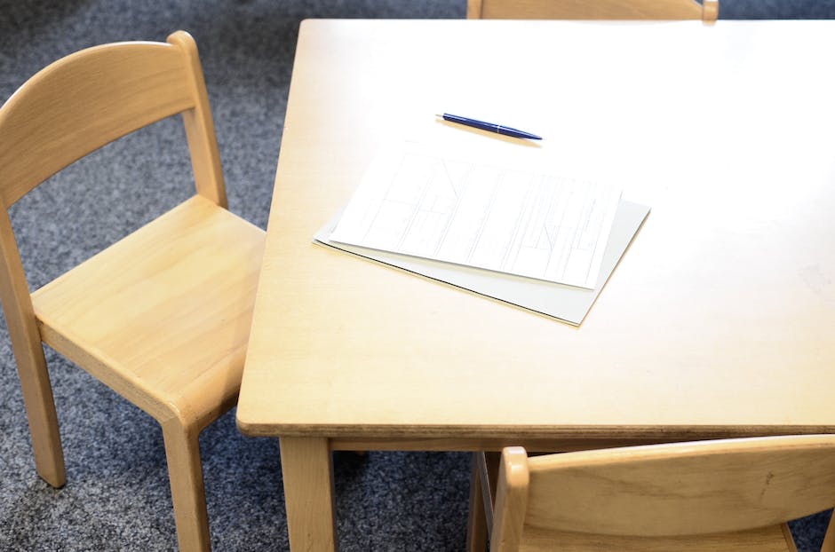 Image showing a person holding a college application form with a checklist, symbolizing the importance of understanding and meeting application requirements.